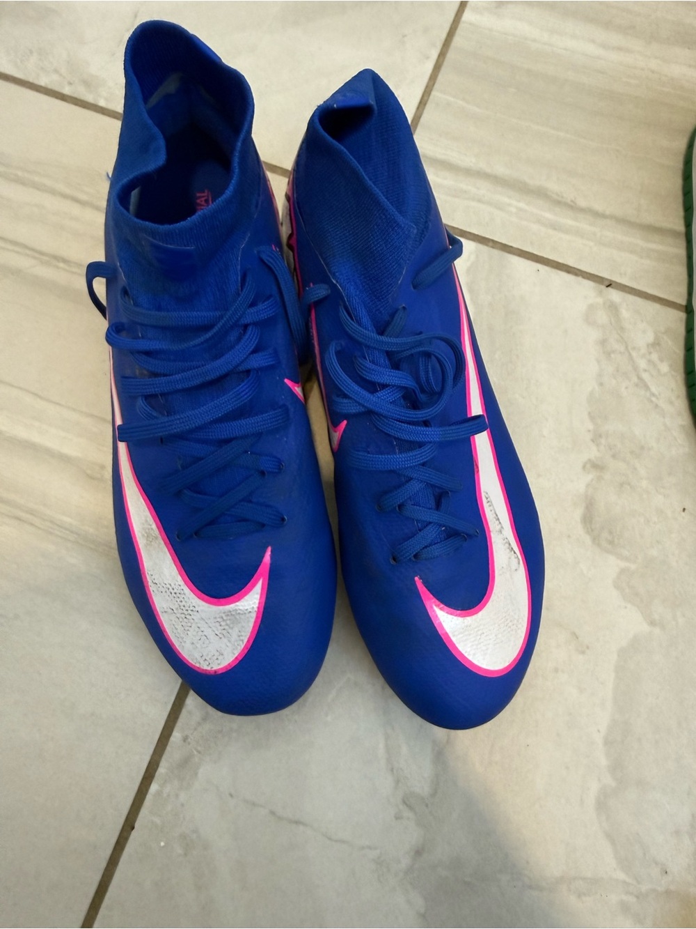Nike Blue unisex but men’s sizing cleats with White and Pink Swoosh